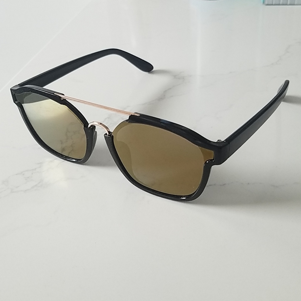 Black frame sunglasses with gold bronze lenses